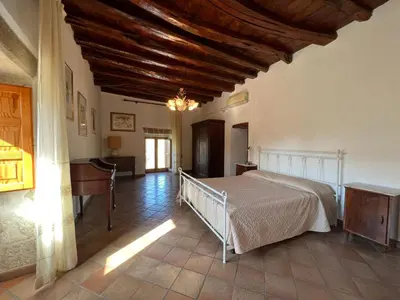 Letto o letti in una camera di Villa Mariuccia