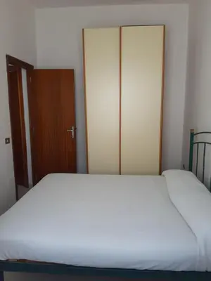 Letto o letti in una camera di Risveglio Marino - A 30 metri dal mare di Nora, casa confortevole