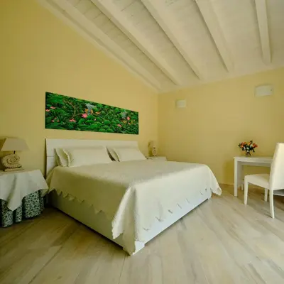 Letto o letti in una camera di Corte dei Mirti, Appartamento indipendente con ampia veranda