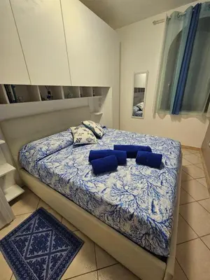 Letto o letti in una camera di Il Faro d'Ogliastra