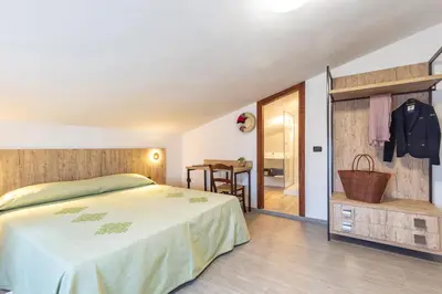 Letto o letti in una camera di Hotel Santa Maria