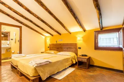 Letto o letti in una camera di Hotel Santa Maria