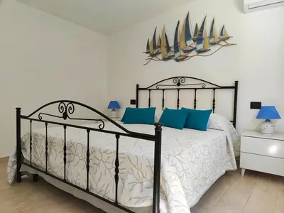 Letto o letti in una camera di Villa Su Giudeu