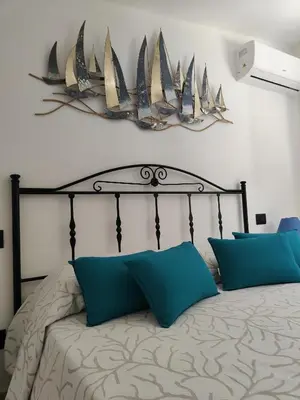 Letto o letti in una camera di Villa Su Giudeu
