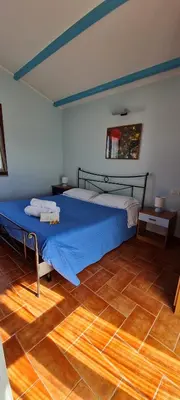 Letto o letti in una camera di Sa Domu Tabarchina