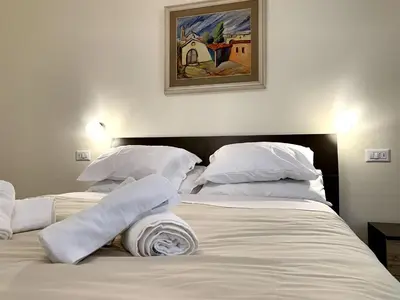 Letto o letti in una camera di Domo Achenza