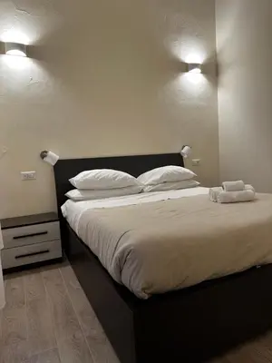 Letto o letti in una camera di Domo Achenza