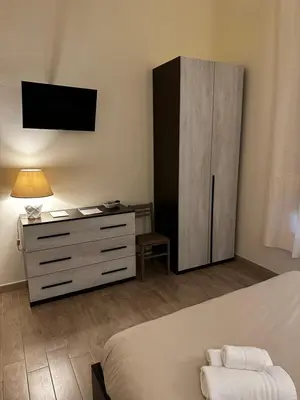 Letto o letti in una camera di Domo Achenza
