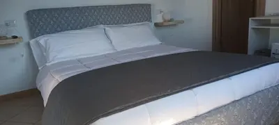 Letto o letti in una camera di L'Attico Villasimius