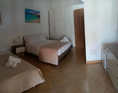 Letto o letti in una camera di L'Attico Villasimius
