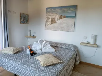 Letto o letti in una camera di L'Attico Villasimius