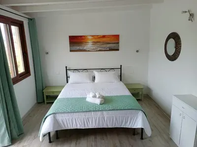 Letto o letti in una camera di L'Attico Villasimius