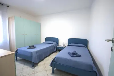 Letto o letti in una camera di Villa Il Melograno