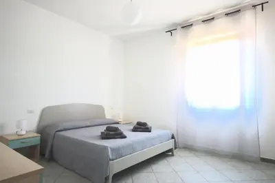 Letto o letti in una camera di Villa Il Melograno