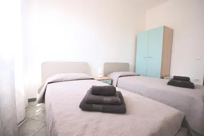 Letto o letti in una camera di Villa Il Melograno