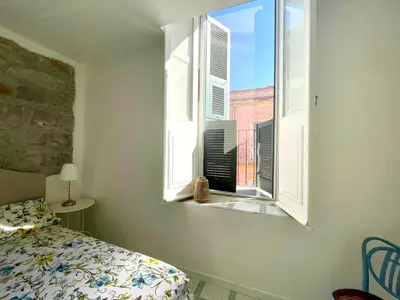 Letto o letti in una camera di Via Roma House Carloforte