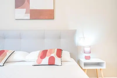 Letto o letti in una camera di Puccini Apt - Centro città - Wifi - AC