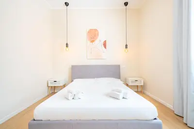 Letto o letti in una camera di Puccini Apt - Centro città - Wifi - AC