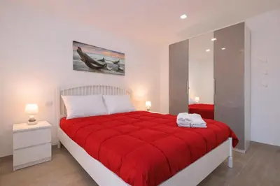 Letto o letti in una camera di Sabamiglia Apartments
