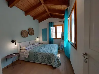 Letto o letti in una camera di villa Sara