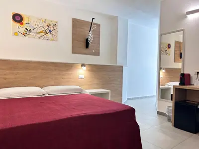 Letto o letti in una camera di Longevity Hotel
