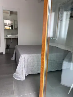 Letto o letti in una camera di Longevity Hotel