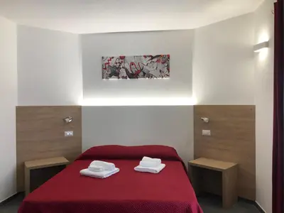 Letto o letti in una camera di Longevity Hotel