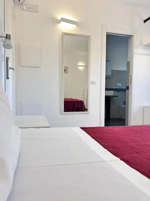 Letto o letti in una camera di Longevity Hotel