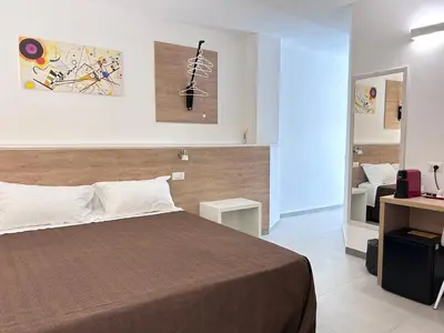 Letto o letti in una camera di Longevity Hotel