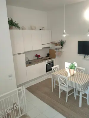 Cucina o angolo cottura di Villetta Soleil con Piscina e Campo da Tennis condominiale