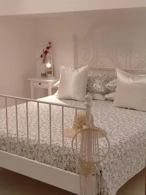 Letto o letti in una camera di Villetta Soleil con Piscina e Campo da Tennis condominiale