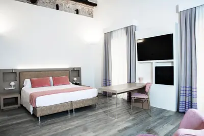 Letto o letti in una camera di Hotel Italia
