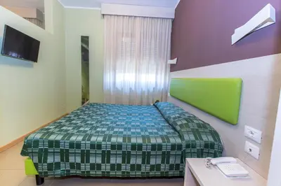Letto o letti in una camera di Hotel Residence Ulivi E Palme