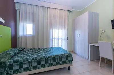 Letto o letti in una camera di Hotel Residence Ulivi E Palme