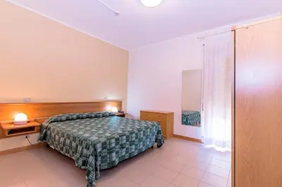 Letto o letti in una camera di Hotel Residence Ulivi E Palme