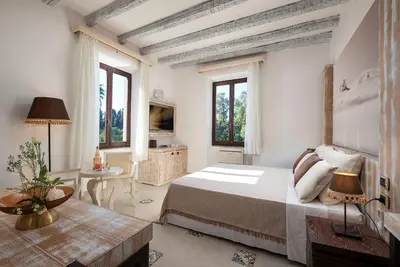 Letto o letti in una camera di Villa Cavalieri Country Hotel