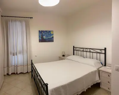 Letto o letti in una camera di Casa Chiara