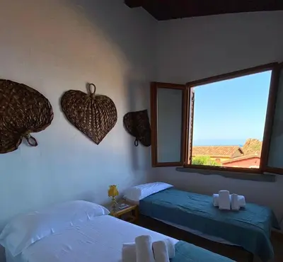 Letto o letti in una camera di Casa Girasole
