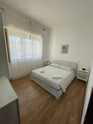 Letto o letti in una camera di Casa Azzurra