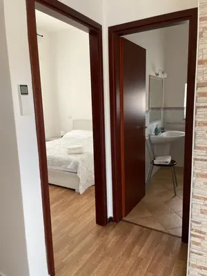 Letto o letti in una camera di Casa Azzurra