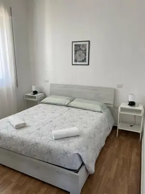 Letto o letti in una camera di Casa Azzurra