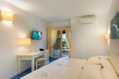 Letto o letti in una camera di Janas Hotel