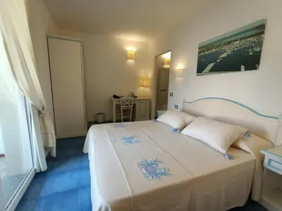 Letto o letti in una camera di Janas Hotel