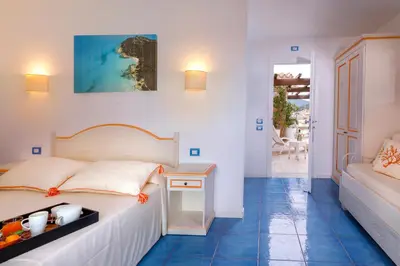 Letto o letti in una camera di Janas Hotel