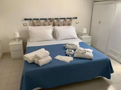 Letto o letti in una camera di Emerald Cottage Calaverde Santa Margherita di Pula
