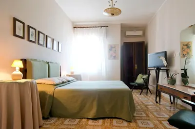 Letto o letti in una camera di Mimì Rooms