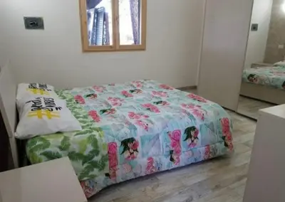 Letto o letti in una camera di Casa Beatrice