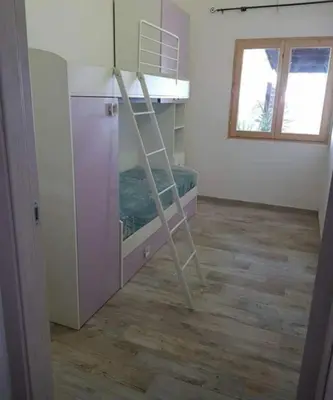 Letto o letti a castello in una camera di Casa Beatrice