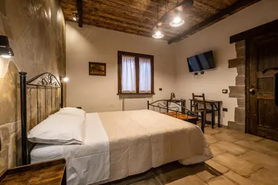 Letto o letti in una camera di Il Rifugio dei Minatori