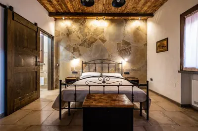 Letto o letti in una camera di Il Rifugio dei Minatori
